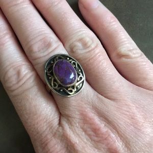 Never worn silver ring with purple stone. Size 8.
